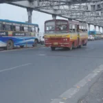 Vehicle are Overpassing Howrah Bridge - Log, colour B&W
