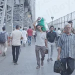 People Passing over Howrah Bridge - Log, colour and B&W