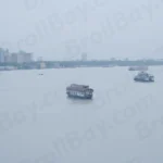 Hooghly River near the Howrah Bridge in Kolkata, India, with Several Boats on the Water - Log, colour and B&W