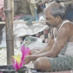 A Man an Making a Garland of Flowers - Log, colour and B&W