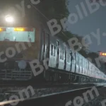 A Train Stopped at a Station at Night - Log , colour and B&W