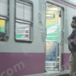 A Man Stands Next to a Moving Mumbai Local Train - Log, colour and B&W