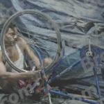 A Man Repairing a Bicycle - Log, colour and B&W