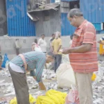 Man selling flowers - Log colour and B&W