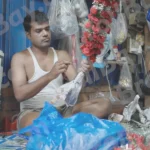 A Man Crafting a Garland - Log, colour and B&W