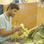 A Man Arranging Lotus Flowers - Log, colour and B&W