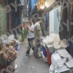 A Narrow Street or Alleyway in a Market - Log, colour and B&W