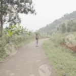 A Man Standing on a Rural Tribal Road - Log, colour and B&W