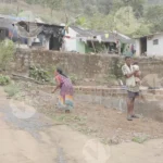 A Woman is Clearing a Field - Log, colour and B&W