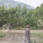 A Woman is Connecting Pipes - Log, colour and B&W