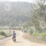 A Motorcycle with Multiple Passengers is Traveling on the Rural Road - Log colour and B&W