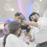 Woman is getting her hair styled by stylists - Log, colour and B&W