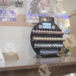 Display of Nail Polish Bottles, in a Salon or Nail Studio - Log, colour and B&W