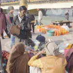 People Sitting and Talking Beside the Hooghly River - Log, colour and B&W