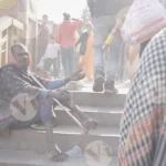 A Man is Begging - Log, colour and B&W