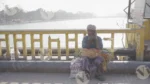 A Man is Sitting on The Bridge in Haridwar - Log, colour and B&W