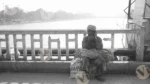 A Man is Sitting on The Bridge in Haridwar - Log, colour and B&W - Image 2