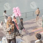 People are Walking and Seller selling  Items in Haridwar - Log, color and B&W