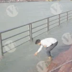 A Man Collection Gangajal from Hooghly River - Log, colour and B&W