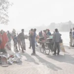 A Crowded Scene in Haridwar, likely Along the Banks of the Ganges River - Log, colour and B&W