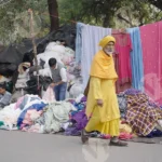 People Looking Cloths in Market - Log, colour and B&W