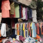 Selling Cloths in Mangolpuri Market - Log, colour and B&W