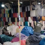 Arranging Clothes in a Shop - Log, colour and B&W