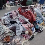 Selling blanket on road - Log, colour and B&W