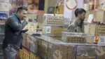 Man Eating Biscuits in a Bakery Shop - Log, colour and B&W