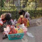 Children Selling Toy on Street - Log, colour and B&W