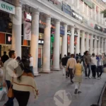 People Walking on Connaught Place Building - Log, colour and B&W