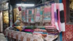 Woman Selling Stoles and Scarves - Log, colour and B&W