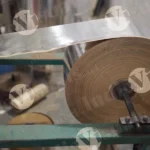 Paper Roll in a Machine - Log, colour and B&W