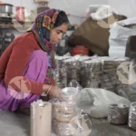 Woman Packing Paper Plate - Log, colour and B&W