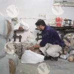 Man Packing Paper Plate - Log, colour and B&W