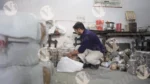 Man Packing Paper Plate - Log, colour and B&W
