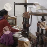 Woman Shaping Plates With a Hand Machine - Log, colour and B&W