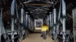 A Man Walking on Foot Overbridge - Log, colour and B&W