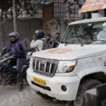 Vehicles are stopped at the railway crossing - Log, colour and B&W