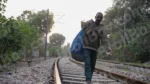 Garbage Man Walking on a Railway Track - Log, colour and B&W