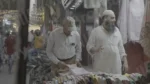 Man Buying Clothes in a Stall - Log, colour and B&W - Image 3