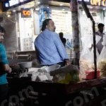 Man Selling Snacks on a Stall - Log, colour and B&W