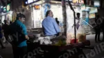Man Selling Snacks on a Stall - Log, colour and B&W