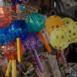 Man Selling Balloon and Toys - Log, colour and B&W
