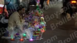 Man Selling Toys in a Street - Log, colour and B&W