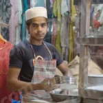 Boy sifting the flour in a Stall - Log, colour and B&W