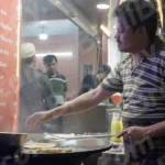 A Man Making Egg Roll - Log, colour and B&W