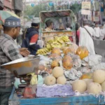 Man Selling Fruits in a Local Market - Log, colour and B&W