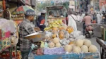 Man Selling Fruits in a Local Market - Log, colour and B&W