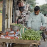 Man Selling Vegetables in a Street Market - Log, colour and B&W